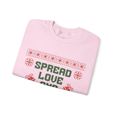 Cozy pink crewneck sweatshirt with "Spread Love and Christmas Cheer" holiday design
