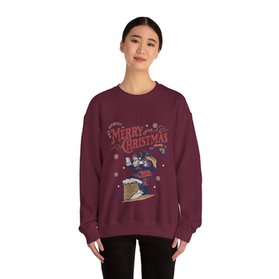 Woman wearing maroon Vintage Santa Crewneck sweatshirt with Santa carrying gift bag going into chimney and Merry Christmas text