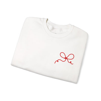 White Coquette Bow Crewneck Sweatshirt with red bow design, festive "The King is Born" faith theme, cotton-poly blend, ribbed collar, adult sizing