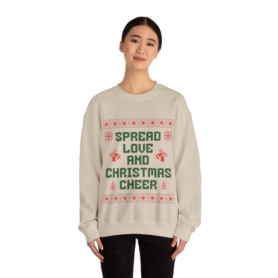 woman wearing cozy beige crewneck sweatshirt with Spread Love and Christmas Cheer holiday design