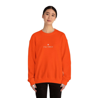 woman wearing orange Fall Things Sweatshirt cozy autumn crewneck sweater