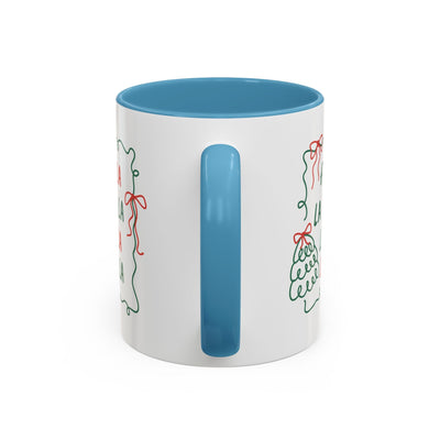 Fa La La Christmas coffee mug with blue handle and minimalist holiday design on white ceramic cup