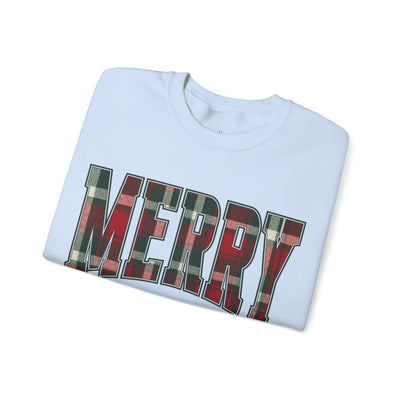 Folded white crewneck sweatshirt with "MERRY" plaid red and green Christmas graphic text