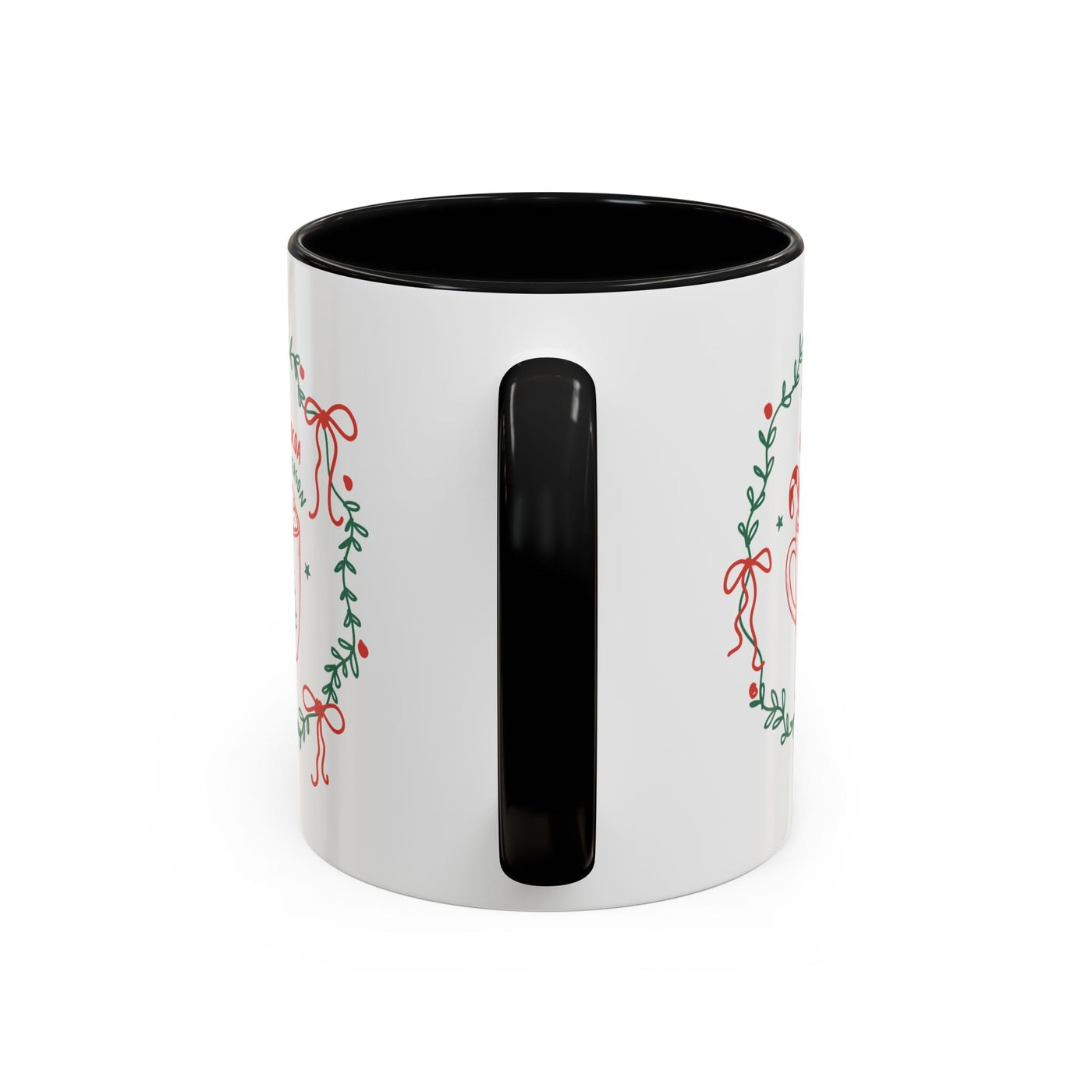 White ceramic mug with black handle and festive holiday wreath design, red interior, available in 11oz and 15oz sizes